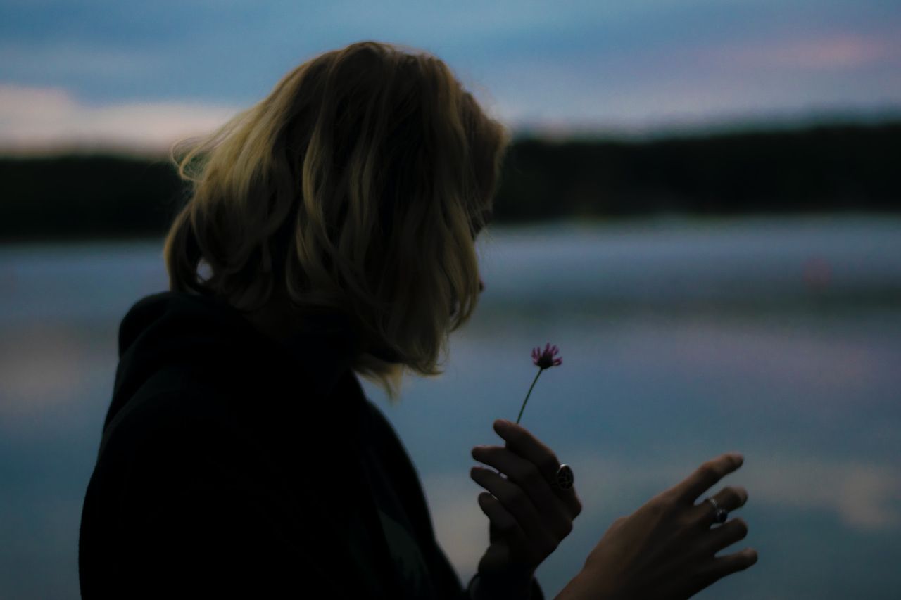 woman-holding-flower